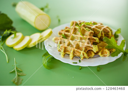 Zucchini waffles with greens isolated on a background 128463468