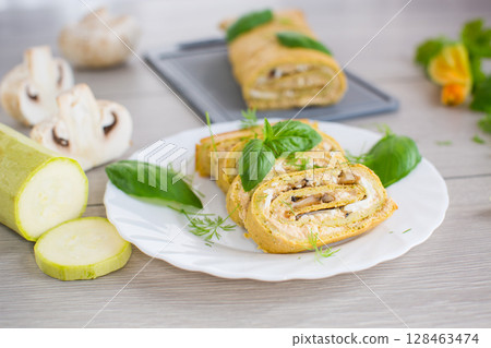 Zucchini roll with cheese and mushrooms on the table Zucchini roll with cheese and mushrooms on the table 128463474