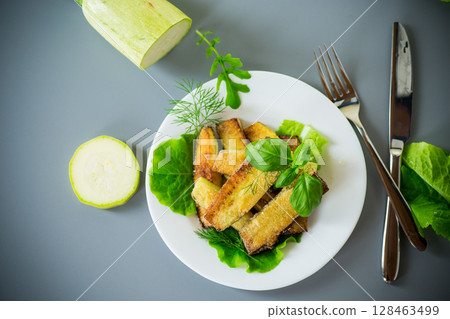Vegetable appetizer of zucchini and dill on a gray background 128463499