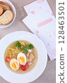 Chicken noodle soup. Chicken broth with egg. Dietary dish. Flat lay. Top view. 128463501