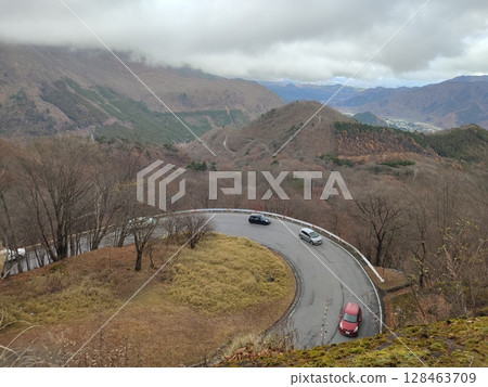 Cars climbing Nikko Irohazaka 128463709