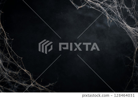 Empty black Halloween background with spider webs in corners. Great for adding custom text or spooky Halloween design. 128464031