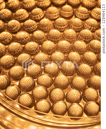 Close-up of shiny yellow vitamin capsules, healthy concept 128464113