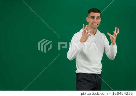 Stressed man sitting on sofa holding his head, feeling overwhelmed and anxious. Man experiencing mental health issues, worry, frustration, and emotional stress. Concept of anxiety and mental health 128464232