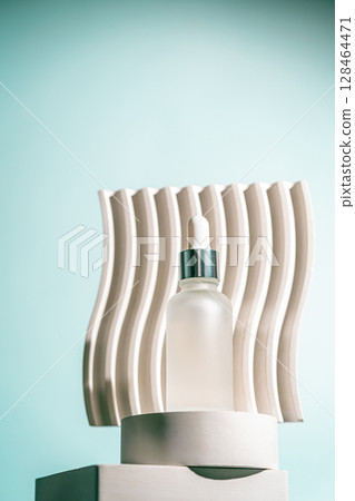A frosted dropper bottle of facial serum A frosted dropper bottle of facial serum 128464471