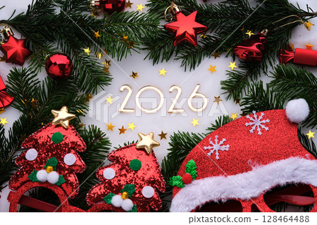 Abstract background of Christmas attributes with the year number 2026. Abstract background of Christmas attributes with the year number 2026. 128464488