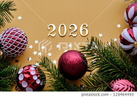 Yellow New Year's background with the number of the coming year 2026. 128464493