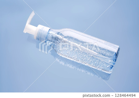 Tube of micellar gel ion a blue background. Tube of micellar gel ion a blue background. 128464494