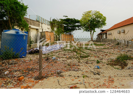 Abandoned Seaside Lot with Ocean View Behind Fence in Mui Ne, Vietnam 128464683