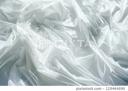 Wrinkled plastic sheet creates an abstract pattern in natural light during the day 128464890