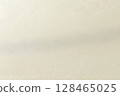 Textured fabric surface showcasing subtle patterns in soft beige tones 128465025