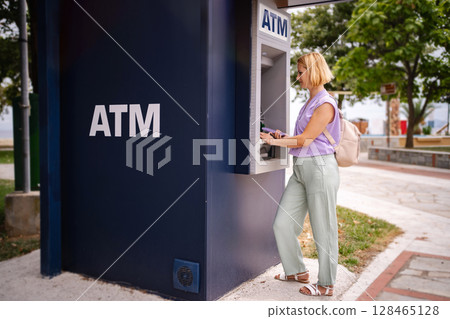 Exploring Greece's summer charm at a local ATM 128465128