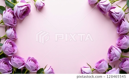 Lavender roses are beautifully arranged in a heart shape, their soft petals contrasting with a light pastel backdrop. This serene composition evokes feelings of love and tranquility. 128465545