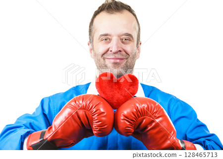 Man with boxing gloves holding heart Man with boxing gloves holding heart 128465713