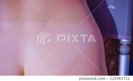 Woman body after taking off bikini with visible tan line from wearing panties Woman body after taking off bikini with visible tan line from wearing panties 128465722
