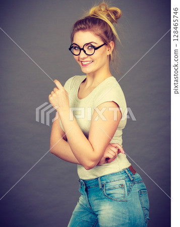 Happy teenage woman wearing eyeglasses Happy teenage woman wearing eyeglasses 128465746