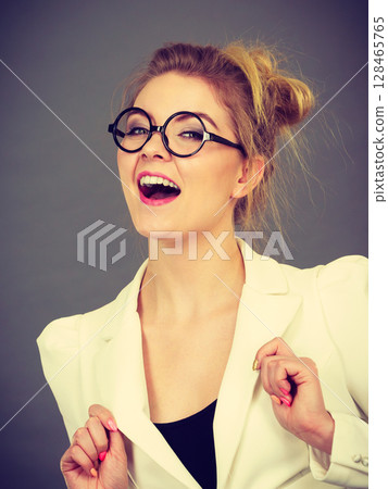Happy positive business woman, accountant or teacher Happy positive business woman, accountant or teacher 128465765