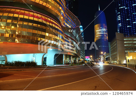 Night road traffic in financial centre, Doha, Qatar Night road traffic in financial centre, Doha, Qatar 128465974