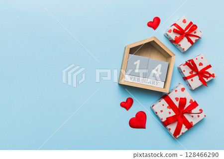 Valentine Day theme with wooden block calendar. Greeting card template for Valentines Day copy space for text 128466290