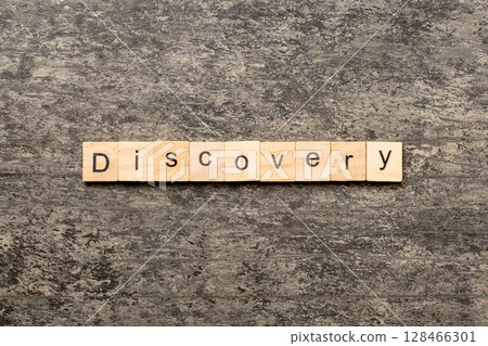 discovery word written on wood block. discovery text on table, concept discovery word written on wood block. discovery text on table, concept 128466301