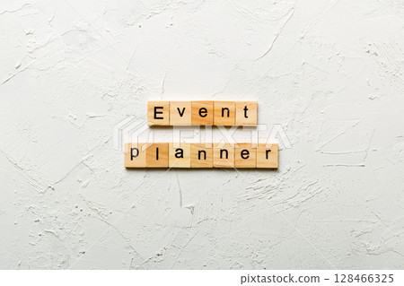 EVENT PLANNER word written on wood block. EVENT PLANNER text on cement table for your desing, concept EVENT PLANNER word written on wood block. EVENT PLANNER text on cement table for your desing, concept 128466325