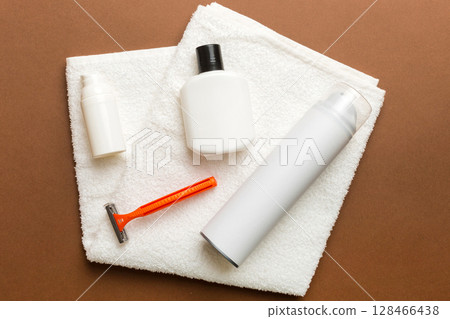 shaving man set. shaving machine, towel, lotion and shaving foam on colored background. Men bath Accessories top view shaving man set. shaving machine, towel, lotion and shaving foam on colored background. Men bath Accessories top view 128466438