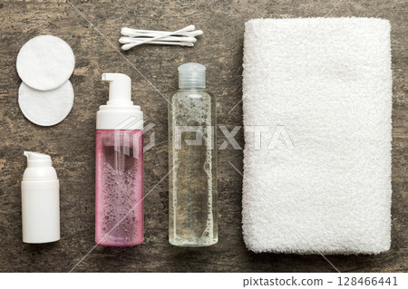 Micellar cleansing water and discs to remove cosmetics and cleanse the skin on colored background. Copy space top view 128466441