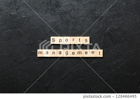 sports management word written on wood block. sports management text on cement table for your desing, concept 128466495