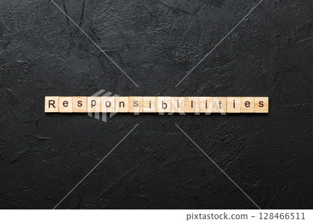 responsibility word written on wood block. responsibility text on table, concept responsibility word written on wood block. responsibility text on table, concept 128466511
