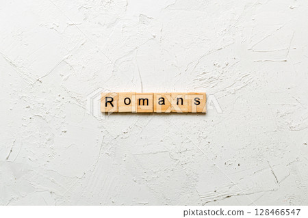 romans word written on wood block. romans text on table, concept romans word written on wood block. romans text on table, concept 128466547