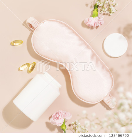 Self care flat lay with mask for sleep, natural sleeping gel capsules, vitamins or dietary supplements on pink background. Concept of healthy sleep and no depression. Natural remedies for relax Self care flat lay with mask for sleep, natural sleeping gel capsules, vitamins or dietary supplements on pink background. Concept of healthy sleep and no depression. Natural remedies for relax 128466790