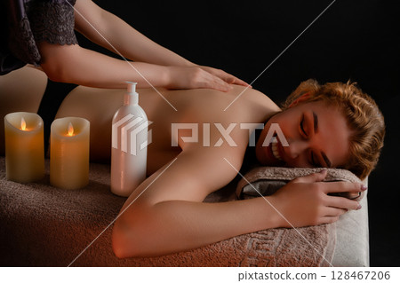 Relaxing massage session in a tranquil studio for rejuvenation and wellness Relaxing massage session in a tranquil studio for rejuvenation and wellness 128467206
