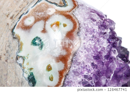 Amethyst Crystal Druse macro mineral on white background Amethyst Crystal Druse macro mineral on white background 128467741