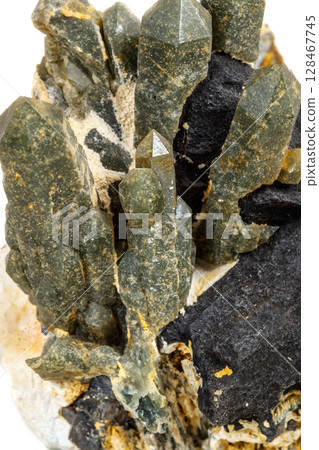 Macro mineral stone Quartz Hedenbergite Prase on ilvite on a white background Macro mineral stone Quartz Hedenbergite Prase on ilvite on a white background 128467745