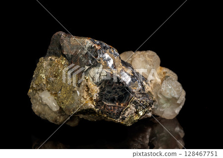 Macro of a mineral stone Sphalerite with fluorite and pyrite on a black background 128467751