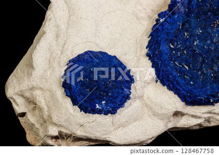 Macro mineral stone Azurite in siltstone against black background 128467758