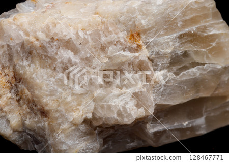 Macro mineral stone Moonstone a black background 128467771