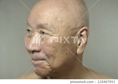 Old man with a smile 128467951