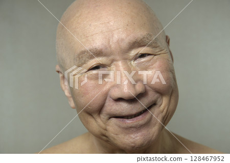 Old man with a smile 128467952