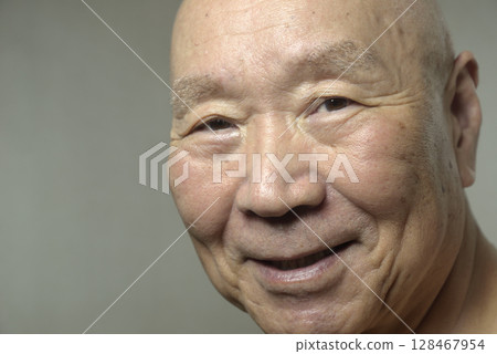Old man with a smile 128467954