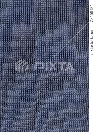 Close-up view of textured fabric in dark navy color showcasing intricate stitching details Close-up view of textured fabric in dark navy color showcasing intricate stitching details 128468124
