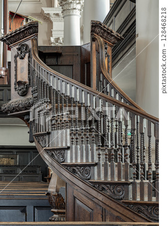 the ornately carved wooden staircase leading to the pulpit in St Martin-in-the-Fields 128468218