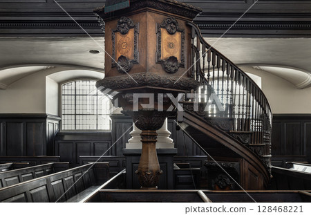 Ornately carved wooden pulpit with an attached staircase, which is located in St Martin-in-the-Fields. 128468221