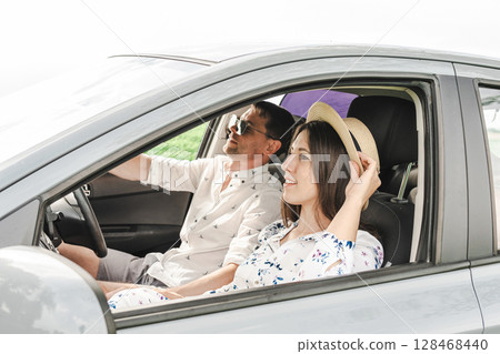 Travel car. Family trip countryside vehicle. Parents daughter outdoor road summer. Travel car. Family trip countryside vehicle. Parents daughter outdoor road summer. 128468440
