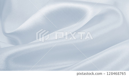 Smooth elegant grey silk or satin luxury cloth as wedding background. Luxurious background design 128468765