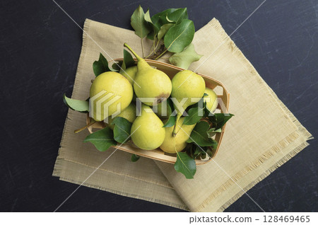 Pears. Fresh sweet organic pears with leaves. Frame of autumn harvest fruits. Top view. Food background. Mock up. Pears. Fresh sweet organic pears with leaves. Frame of autumn harvest fruits. Top view. Food background. Mock up. 128469465