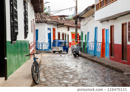 Traditional motor tricycle at the beautiful streets of the colonial town of Concepcion in Antioquia, Colombia. 128470131