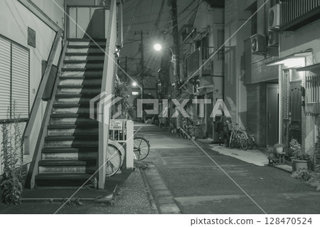Monochrome photo: Apartment with retro stairs, nighttime, residential area 128470524