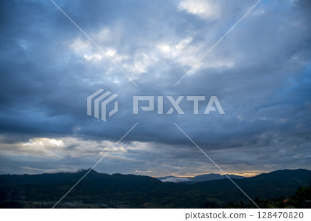 Scenic view dramatic beautiful sunset sky. Natural Sunset Sunrise on meadow silhouette shadow dark land. Vibrant dramatic sky on sunset, dawn, sunrise in Countryside. Landscape Colorful Sky At Sunset Scenic view dramatic beautiful sunset sky. Natural Sunset Sunrise on meadow silhouette shadow dark land. Vibrant dramatic sky on sunset, dawn, sunrise in Countryside. Landscape Colorful Sky At Sunset 128470820