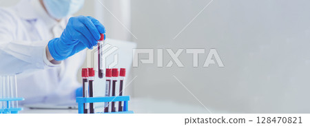 Banner Scientist man look Microscope research in science laboratory. Banner Asian scientist use microbiology microscope in laboratory equipment chemistry lab. Biochemistry experiment with copy space 128470821